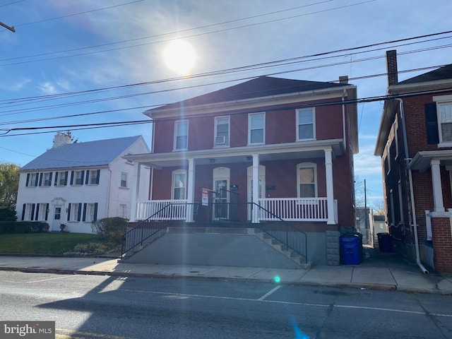 multi unit property featuring a porch