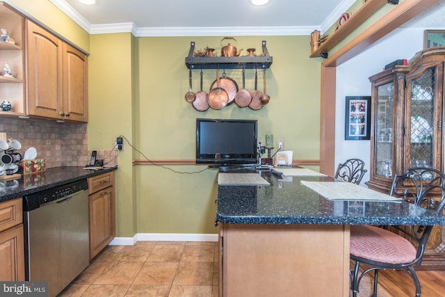 kitchen featuring dark stone counters, stainless steel dishwasher, decorative backsplash, ornamental molding, and a kitchen bar