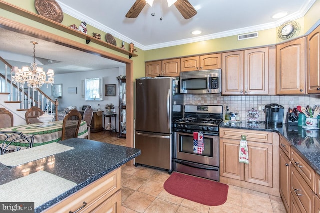 kitchen featuring stainless steel appliances, backsplash, crown molding, pendant lighting, and light tile patterned floors