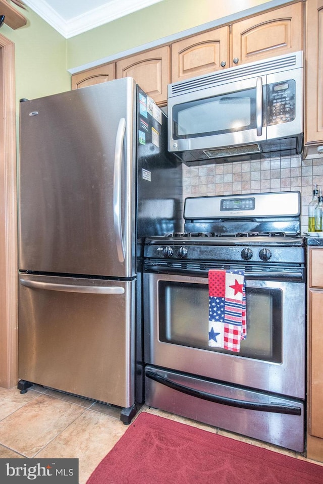 kitchen with backsplash, ornamental molding, stainless steel appliances, light tile patterned floors, and light brown cabinets