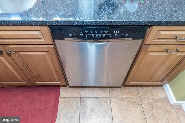 details with dishwasher and dark stone counters