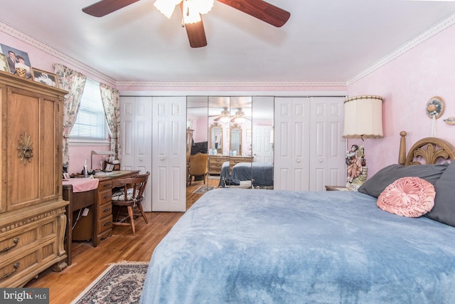 bedroom with hardwood / wood-style flooring, ceiling fan, and crown molding