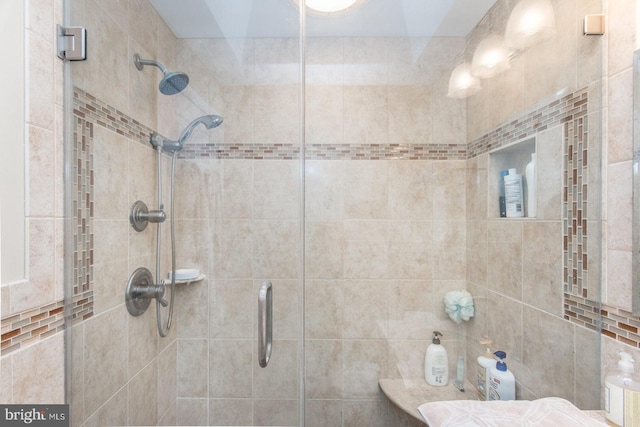 bathroom featuring an enclosed shower