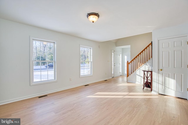 entryway with light hardwood / wood-style floors