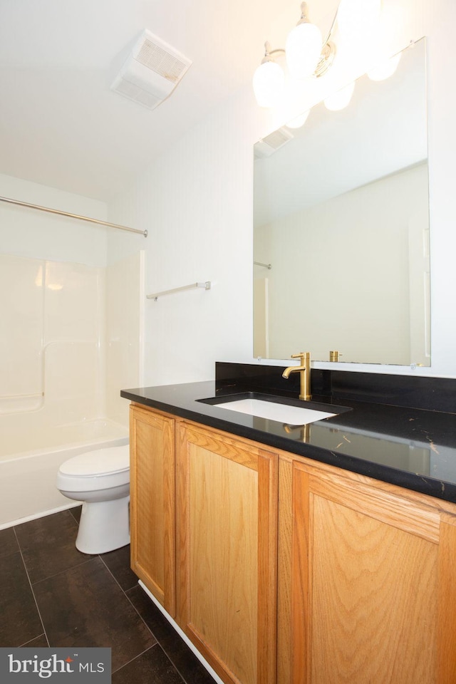 full bathroom featuring vanity,  shower combination, an inviting chandelier, tile patterned flooring, and toilet