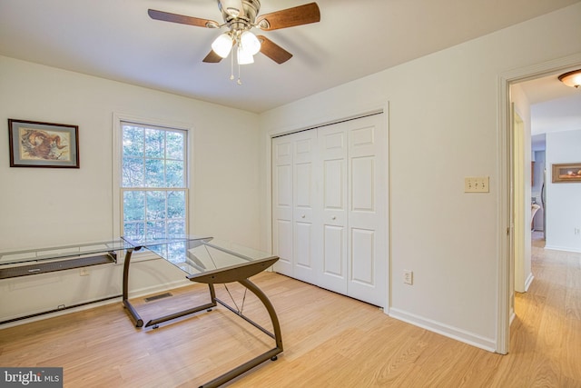 office featuring ceiling fan and light wood-type flooring