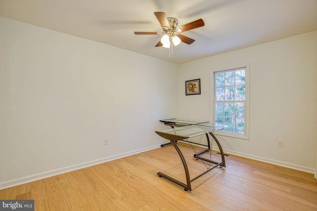 office with hardwood / wood-style flooring and ceiling fan