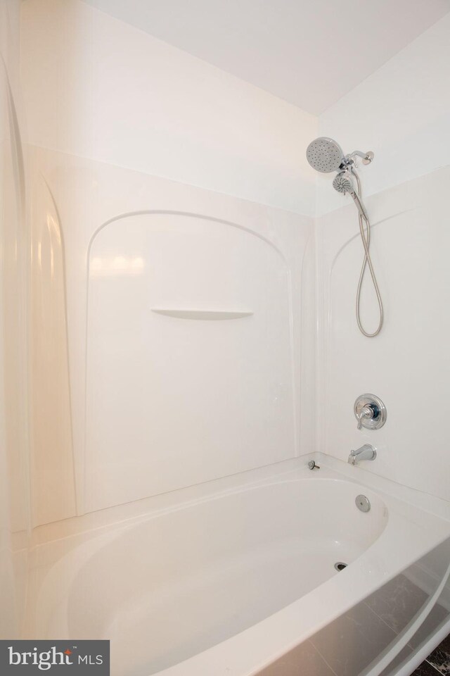 bathroom featuring  shower combination