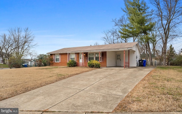 ranch-style house with a front yard and a carport