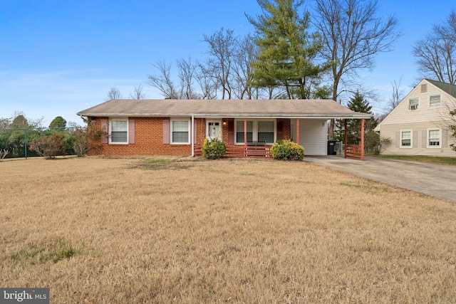 ranch-style home with a carport and a front yard