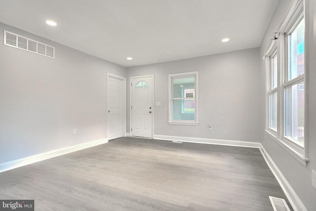 entrance foyer with dark hardwood / wood-style flooring