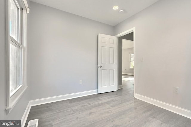 spare room with light wood-type flooring