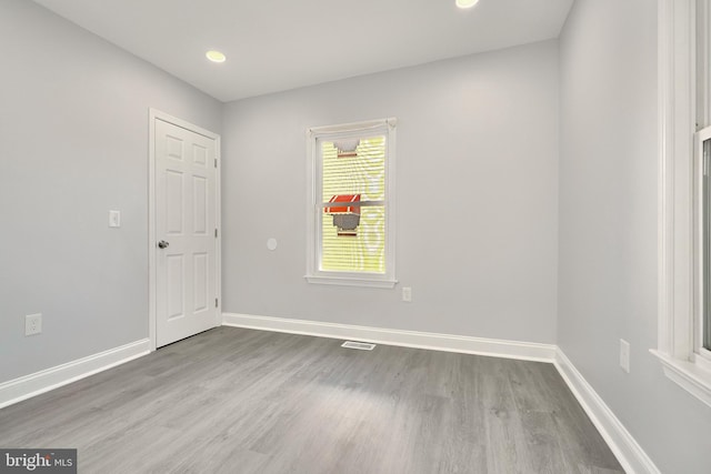 empty room with wood-type flooring