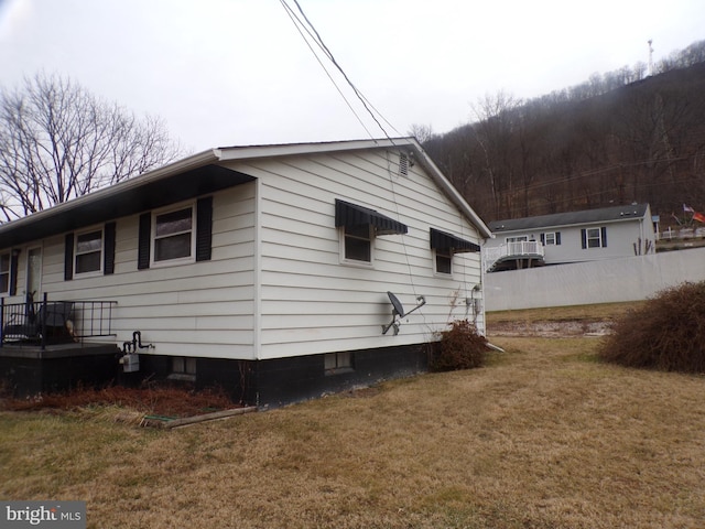 view of home's exterior featuring a lawn