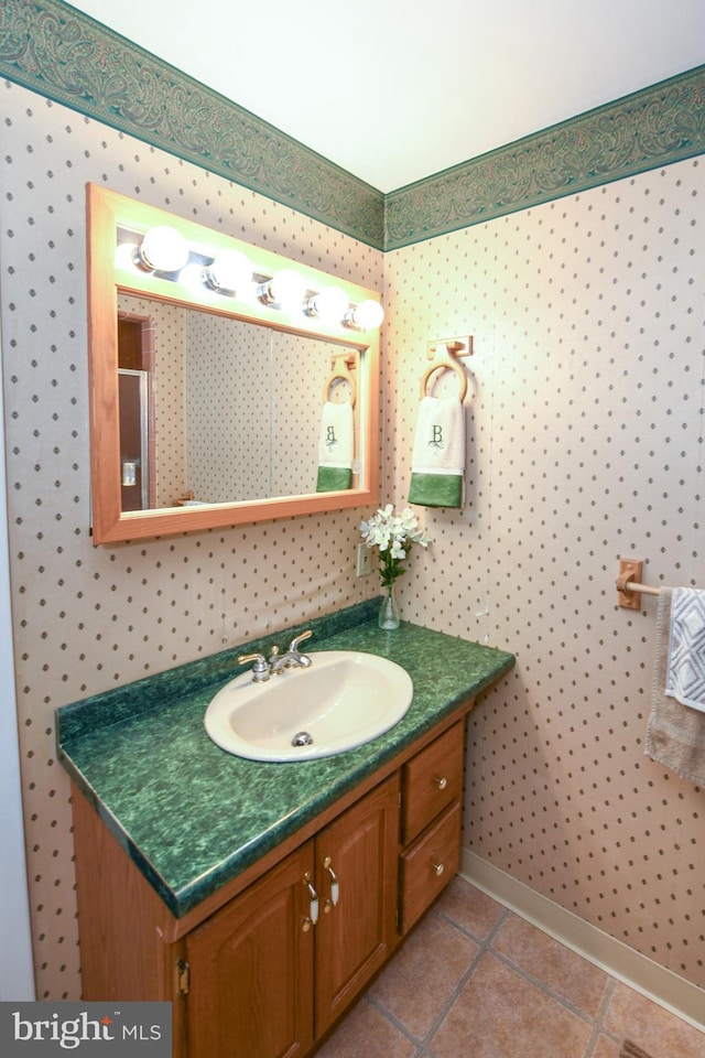 bathroom with tile patterned floors and vanity