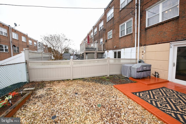 view of yard with a wooden deck