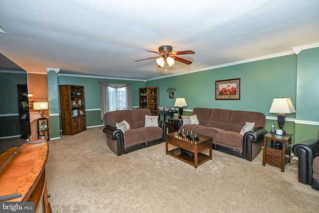 carpeted living room featuring ceiling fan and ornamental molding