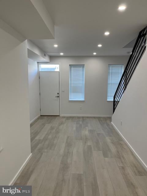 foyer with light hardwood / wood-style floors