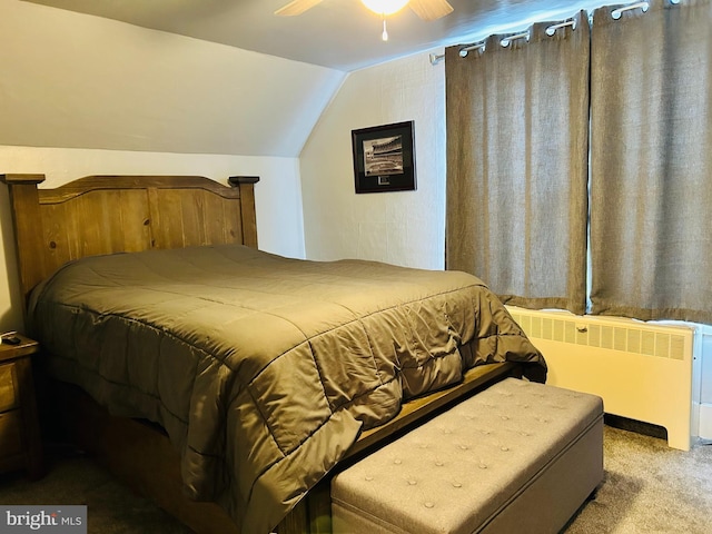 carpeted bedroom featuring ceiling fan, radiator heating unit, and vaulted ceiling