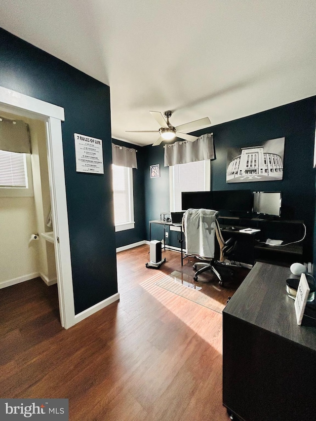 home office with hardwood / wood-style floors and ceiling fan