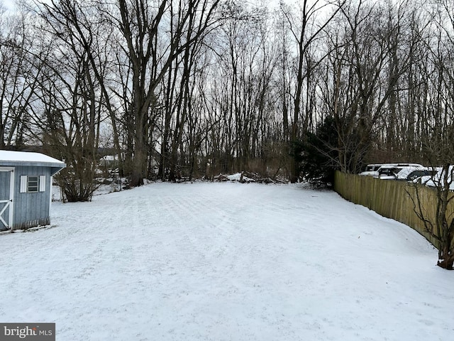 view of yard layered in snow