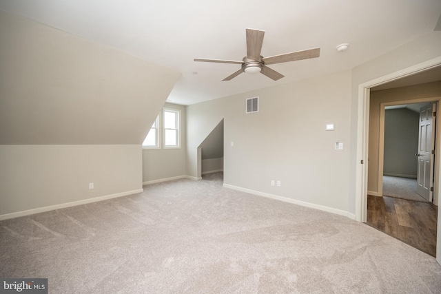 bonus room with ceiling fan, carpet, and lofted ceiling