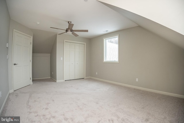 bonus room featuring ceiling fan, light colored carpet, and lofted ceiling