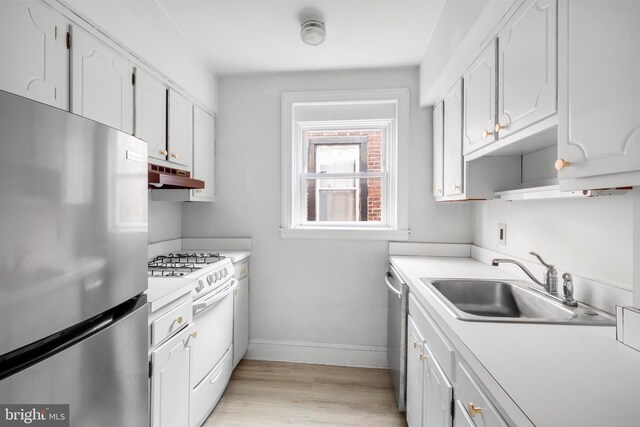 kitchen featuring light hardwood / wood-style flooring, stainless steel appliances, white cabinetry, and sink