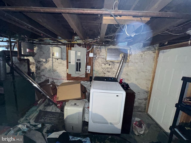 basement featuring washer / dryer and electric panel