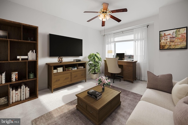 living room featuring ceiling fan and carpet