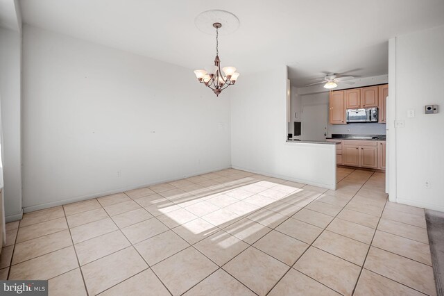 interior space with ceiling fan with notable chandelier and light tile patterned floors