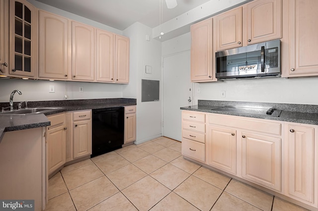 kitchen with black appliances, light brown cabinets, sink, and light tile patterned floors