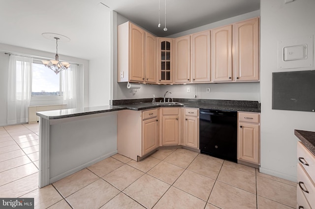 kitchen with sink, dishwasher, light tile patterned flooring, hanging light fixtures, and a chandelier