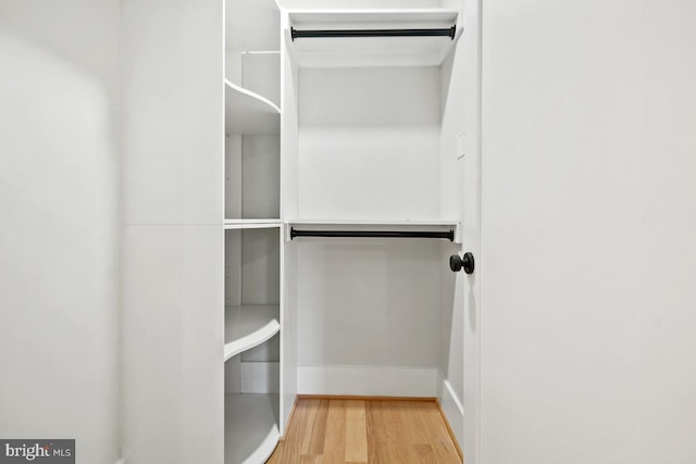 walk in closet featuring hardwood / wood-style floors