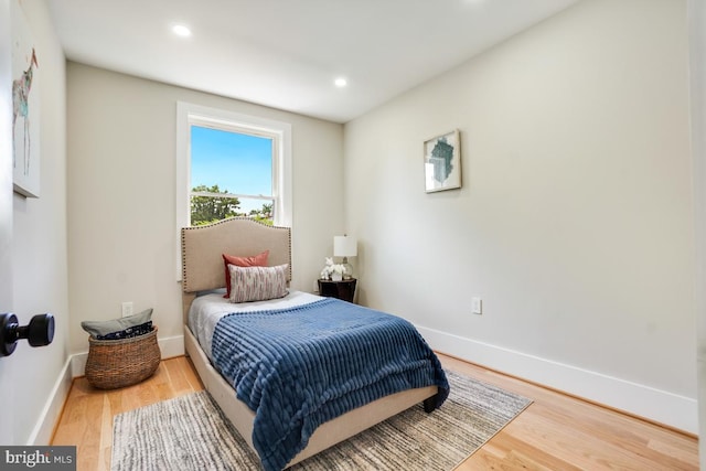 bedroom with wood-type flooring