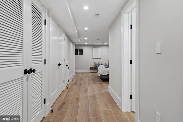 corridor featuring light wood-type flooring