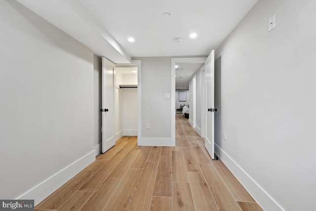 corridor featuring light hardwood / wood-style flooring