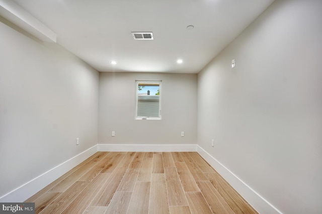 unfurnished room with light wood-type flooring