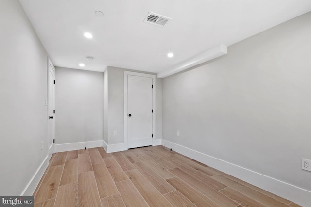 spare room featuring light hardwood / wood-style flooring