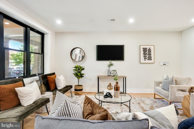 living room with light hardwood / wood-style floors