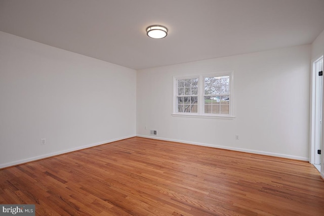 unfurnished room featuring light wood-type flooring