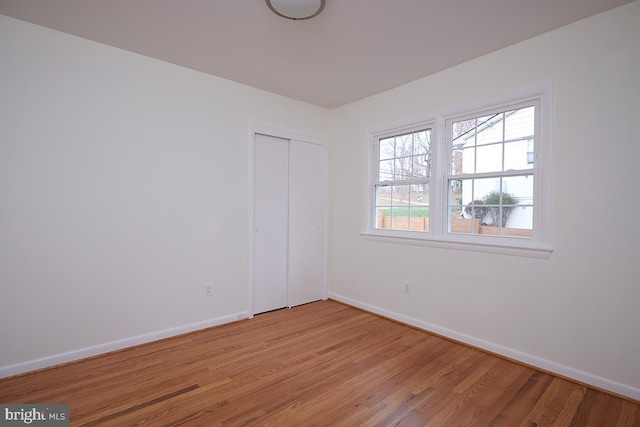 spare room featuring light wood-type flooring