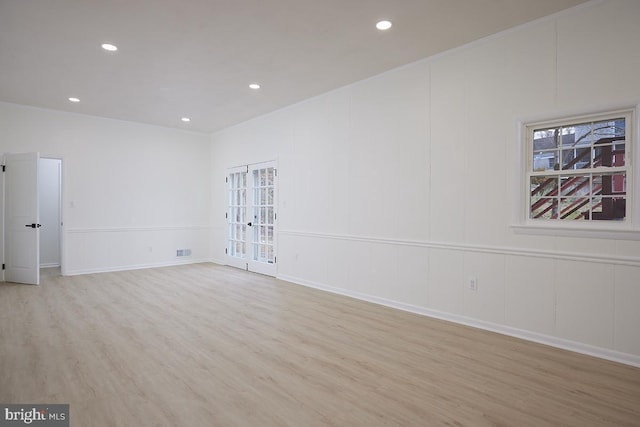 spare room featuring light hardwood / wood-style floors