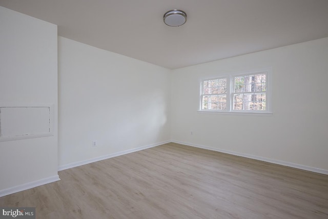 empty room with light wood-type flooring