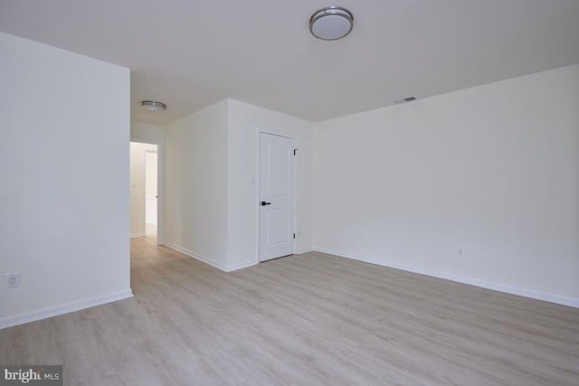 unfurnished room with light hardwood / wood-style flooring