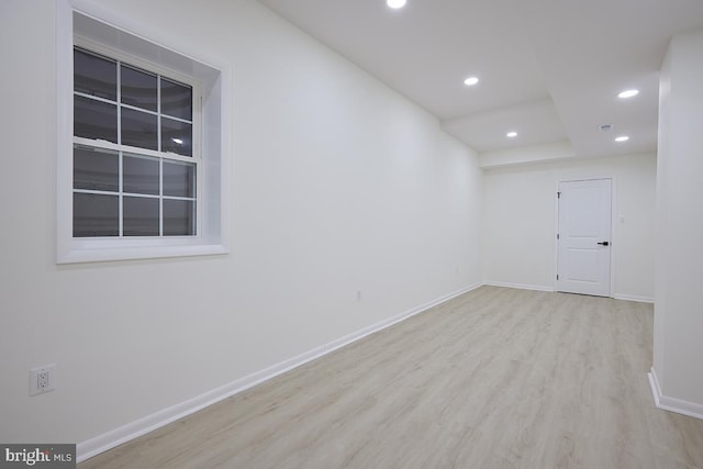 unfurnished room with light hardwood / wood-style floors