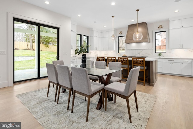 dining area with recessed lighting and light wood-style floors