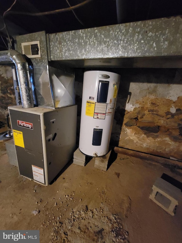 utility room with heating unit and water heater