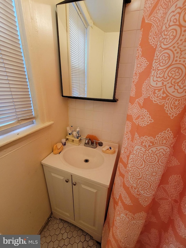 bathroom with tile patterned flooring and vanity