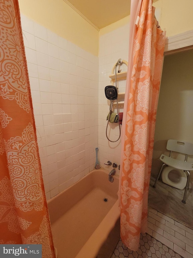 bathroom featuring tile patterned flooring and shower / bath combination with curtain